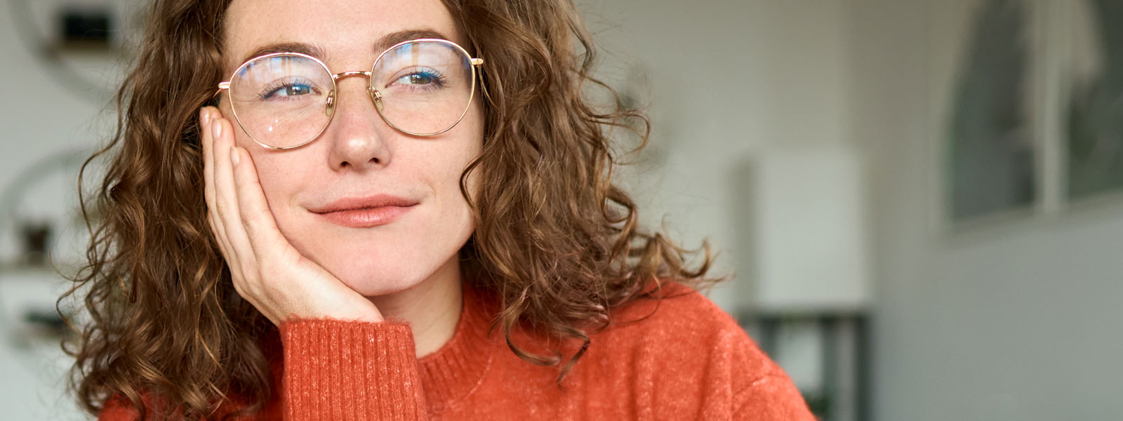 A woman daydreaming in the office