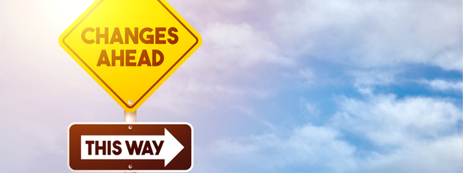 A yellow traffic sign with the text "CHANGES AHEAD THIS WAY" against a cloudy outdoor sky.