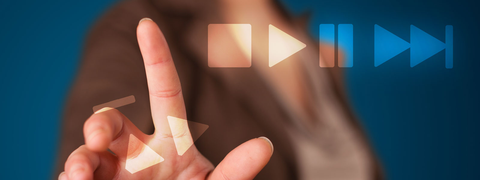 A close-up photo of a woman's hand trying to press a rewind button that is falling apart