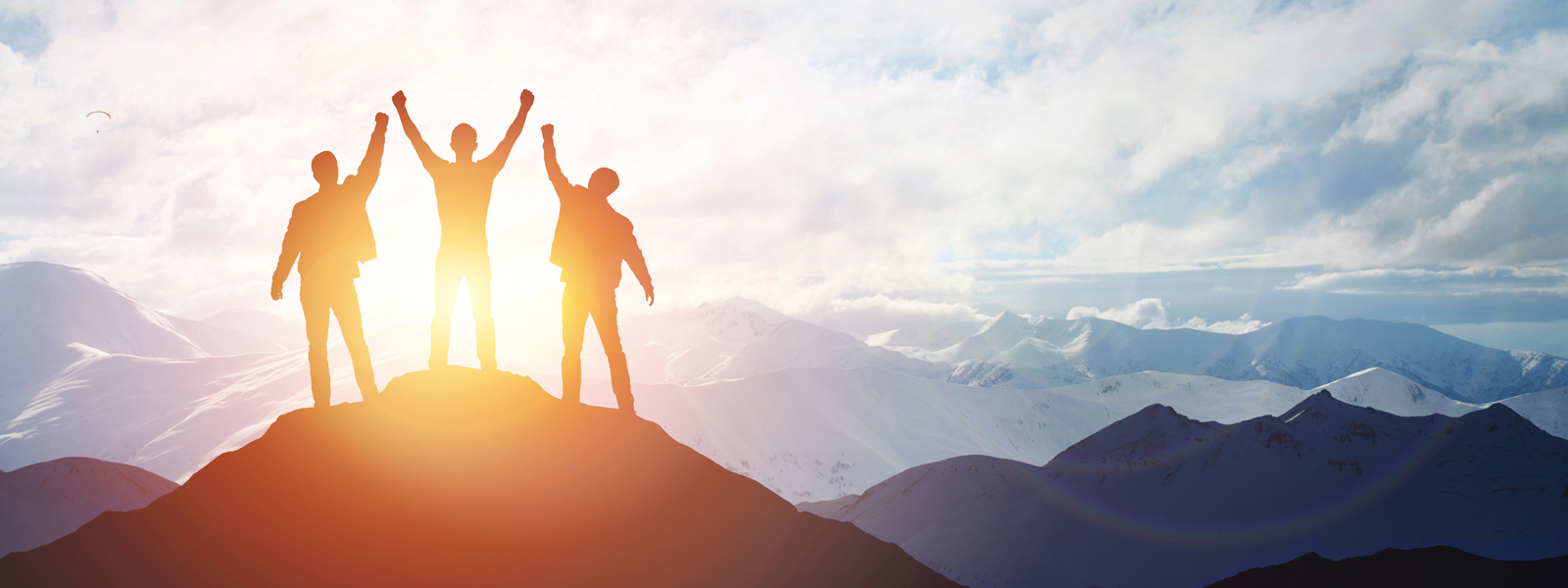 A team at the top of a mountain